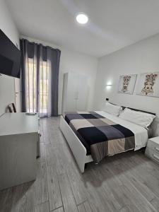 Posteľ alebo postele v izbe v ubytovaní FronteMare Locazione Turistica
