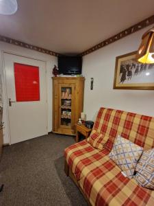 O zonă de relaxare la Montagne Studio Prapoutel Station +18 fotografii