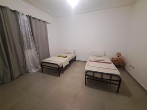 Postel nebo postele na pokoji v ubytování Barros Homestay