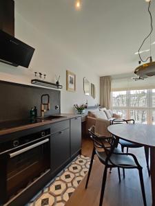 Η κουζίνα ή μικρή κουζίνα στο Apartament N7 Centrum