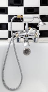 a bathroom sink with a faucet on a counter at Hotel Ermitage in Saint-Tropez