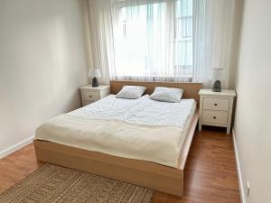 Łóżko lub łóżka w pokoju w obiekcie Apartament w kamienicy Gdynia