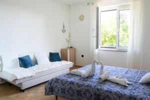 Ένα ή περισσότερα κρεβάτια σε δωμάτιο στο Champagne Apartments