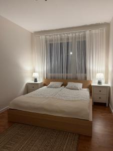 Łóżko lub łóżka w pokoju w obiekcie Apartament w kamienicy Gdynia