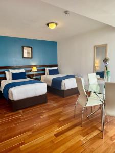 Cama ou camas em um quarto em Wayqey Hotel