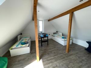 En eller flere senge i et værelse på Ferienhaus Villa Wunderbar Dangast im Nordsee Park am Jadebusen