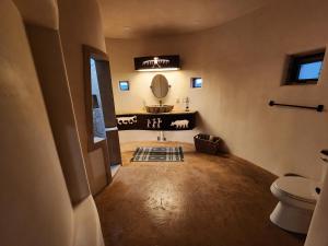 a bathroom with a sink and a mirror at Sky Village in Cortez +27 photos