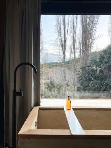 a sink in a kitchen with a window at Corrales de la Aldea Alojamiento Paisajístico in Pontones +36 photos