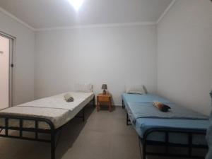 Postel nebo postele na pokoji v ubytování Barros Homestay