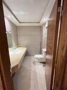 a bathroom with a toilet and a sink at COMFY ZONe in Sharm El Sheikh +16 photos
