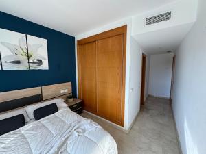 A bed or beds in a room at Arenal Golf Apartment Még 30 kép