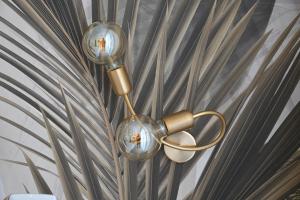 a light fixture hanging on a wall at Barimare in Bari