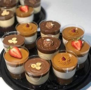 a plate of chocolate desserts with strawberries on top at kazbon House in Al Hāshimīyah