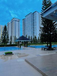 a park with two tall buildings in the background at Wind Suites Tagaytay Condotel in Tagaytay