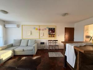 a living room with a couch and a table at Mirador del Puerto in Santa Fe