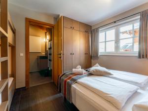 Postel nebo postele na pokoji v ubytování Chalet Schneelöwe XL