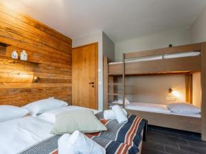 Postel nebo postele na pokoji v ubytování Chalet Schneelöwe XL