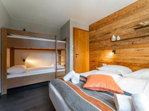Postel nebo postele na pokoji v ubytování Chalet Schneelöwe XL