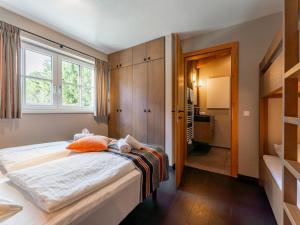 Postel nebo postele na pokoji v ubytování Chalet Schneelöwe XL
