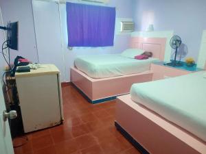 Voodi või voodid majutusasutuse Hotel Kevin toas