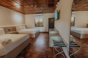 Postel nebo postele na pokoji v ubytování Hotel Boutique Rebequet
