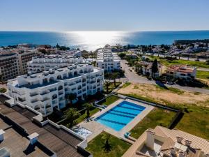 an aerial view of a resort with a swimming pool at Estúdio AMar - Always Algarve in Porches