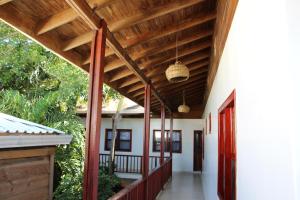 a hallway of a house with a wooden ceiling at Splash Inn Dive Resort & Villas in West End