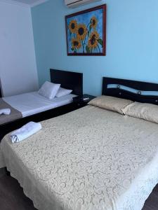 Postel nebo postele na pokoji v ubytování SGH Rodadero Suites