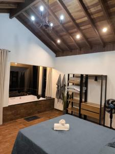 a room with a table with a hat on it at Chalés Vista da Serra in Cunha