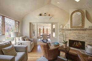 a living room with a fireplace and a couch at 3770 Stone's Throw home in Carmel