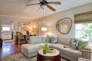 a living room with a couch and a ceiling fan at Stylish Central Napa Home with Serene Private Yard in Napa