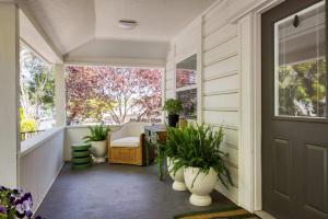 a porch with potted plants and a door at Stylish Central Napa Home with Serene Private Yard in Napa +52 photos
