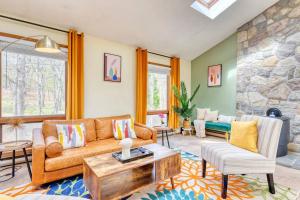 a living room with a couch and a table at Hot Tub Sauna Steam Room in East Stroudsburg