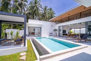 an image of a house with a swimming pool at Villa Petra in Nathon Bay