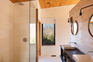 a bathroom with a shower and a sink at Willow Creek - Modern Sunlit Bungalow in Hillier