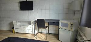 Kuchyň nebo kuchyňský kout v ubytování New Frontier Hotel
