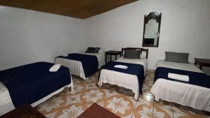 Postel nebo postele na pokoji v ubytování Hotel Marjenny