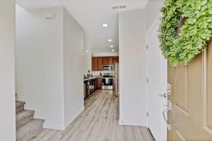 a hallway with a door leading to a kitchen at Charming Centrally Located Treasure Valley Custom in Nampa