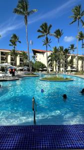 La alberca dentro o cerca de Porto de galinhas flat marulhos resort