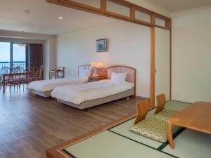 Voodi või voodid majutusasutuse Izumigo AMBIENT Izu-Kogen Condominium toas