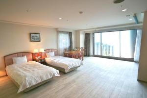 Voodi või voodid majutusasutuse Izumigo AMBIENT Izu-Kogen Condominium toas
