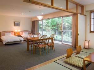 Postel nebo postele na pokoji v ubytování Izumigo AMBIENT Izu-Kogen Condominium