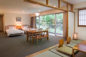 Voodi või voodid majutusasutuse Izumigo AMBIENT Izu-Kogen Condominium toas