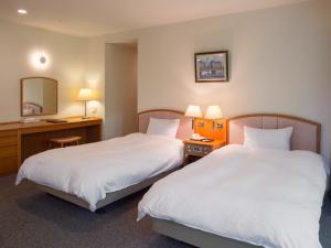 Voodi või voodid majutusasutuse Izumigo AMBIENT Izu-Kogen Condominium toas