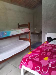 Cama ou camas em um quarto em Sítio Recanto das Jaboticabeiras