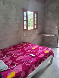 Cama ou camas em um quarto em Sítio Recanto das Jaboticabeiras