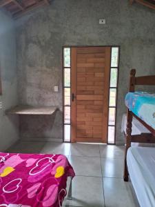 Cama ou camas em um quarto em Sítio Recanto das Jaboticabeiras