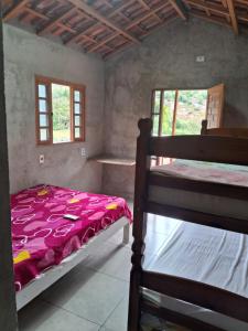 Cama ou camas em um quarto em Sítio Recanto das Jaboticabeiras