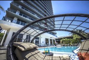The swimming pool at or close to Miami Beach Luxury Apt 1B 1B with pool and gym