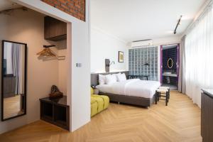 Postel nebo postele na pokoji v ubytování Santisookmidtown Pattani